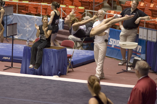Courtney Kupets in a swan dive